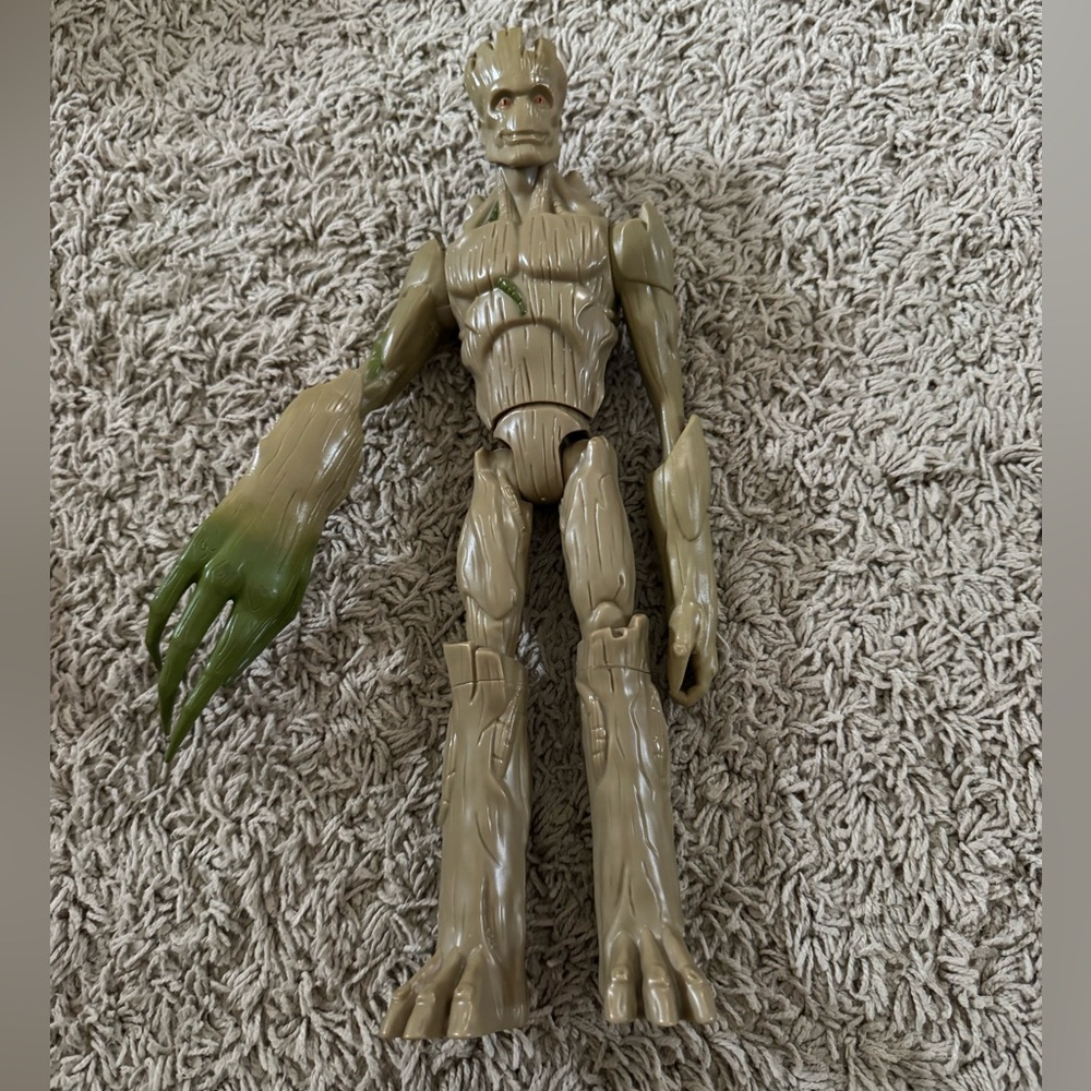 Groot action figure with extendable legs.